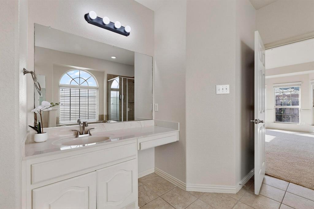 9329 Turtle Pass Fort Worth, TX 76177 - Photo 17 of 31 a bathroom with a sink and a mirror