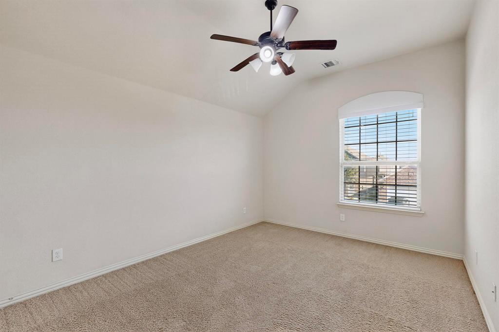 9329 Turtle Pass Fort Worth, TX 76177 - Photo 26 of 31 an empty room with a window and a fan