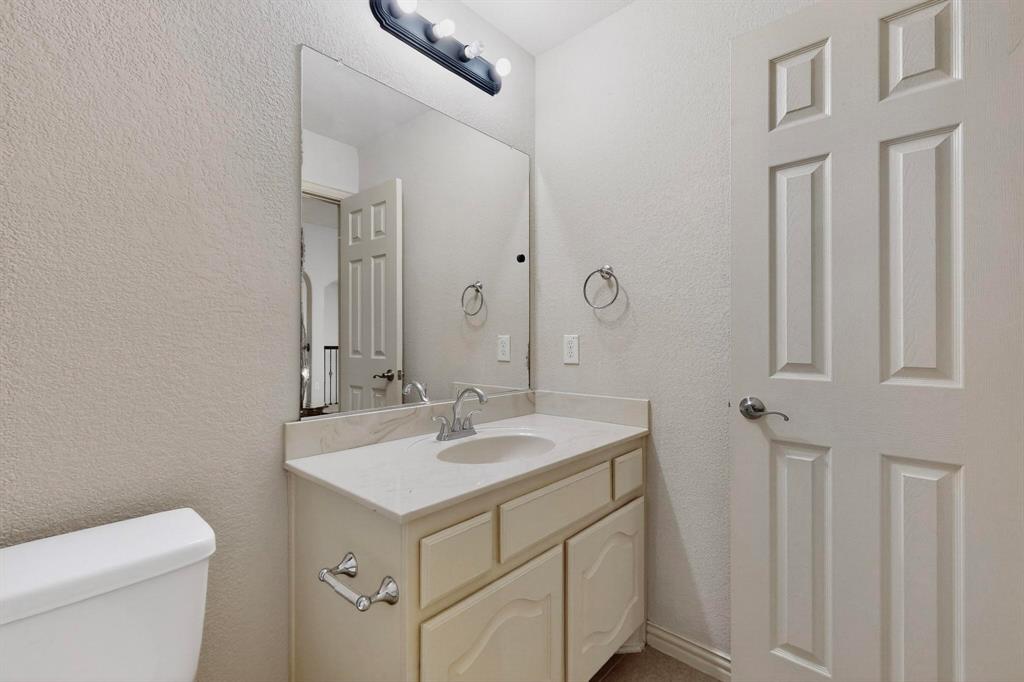 9329 Turtle Pass Fort Worth, TX 76177 - Photo 27 of 31 a bathroom with a sink toilet and shower