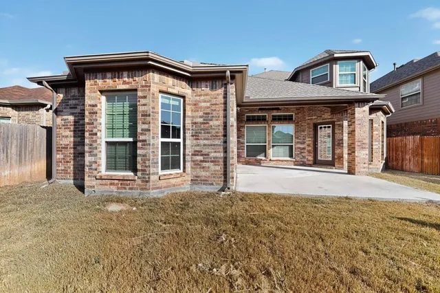 front view of a house with a small yard