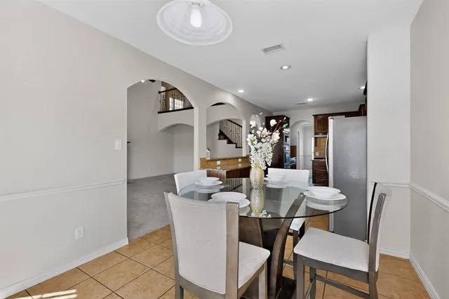 a view of staircase with wooden floor and white walls