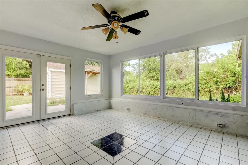 8330 Lafitte Drive Hudson, FL 34667 - Photo 19 of 34 a view of empty room with wooden floor and fan