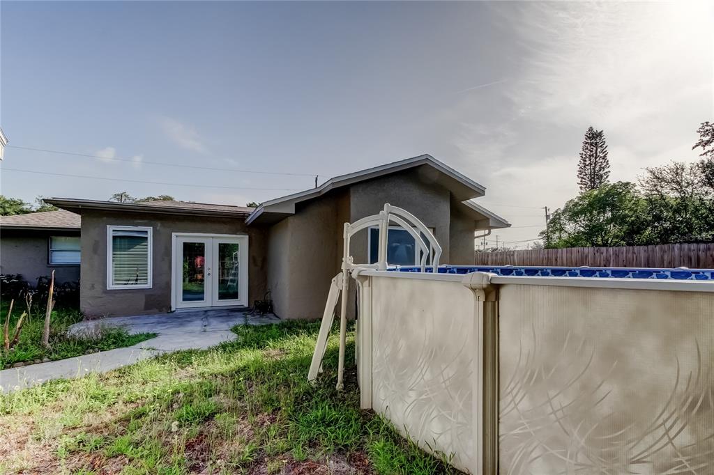 8330 Lafitte Drive Hudson, FL 34667 - Photo 23 of 34 a house with trees in the background