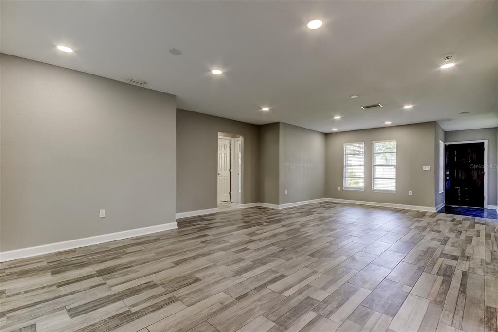 8330 Lafitte Drive Hudson, FL 34667 - Photo 27 of 34 a view of an empty room with window and wooden floor