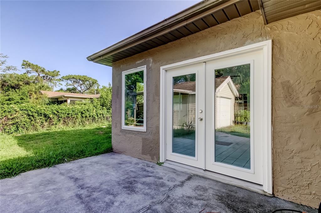 8330 Lafitte Drive Hudson, FL 34667 - Photo 30 of 34 a view of a house with a yard