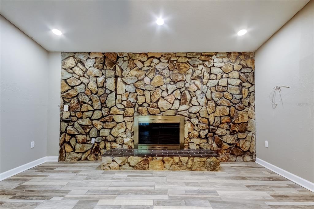 8330 Lafitte Drive Hudson, FL 34667 - Photo 4 of 34 a room with a fireplace