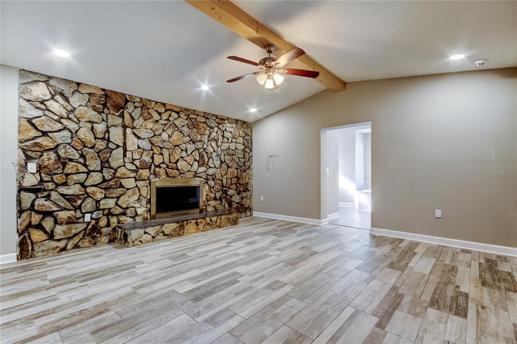 8330 Lafitte Drive Hudson, FL 34667 - Photo 5 of 34 a view of a livingroom with a fireplace
