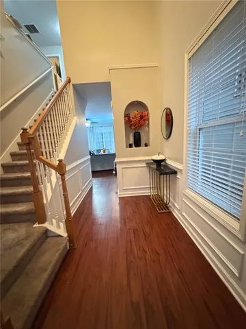 a view of entryway with wooden floor