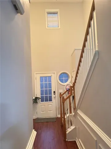 a view of entryway with wooden floor
