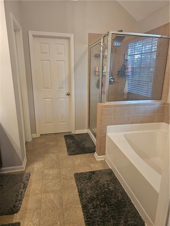 5639 Chatham Circle Northwest Norcross, GA 30071 - Photo 9 of 16 a bathroom with a bathtub and shower