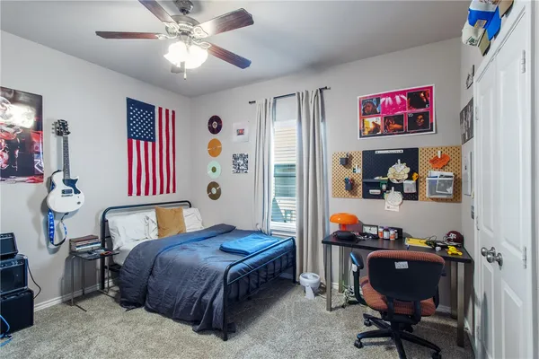 a room with furniture and ceiling fan
