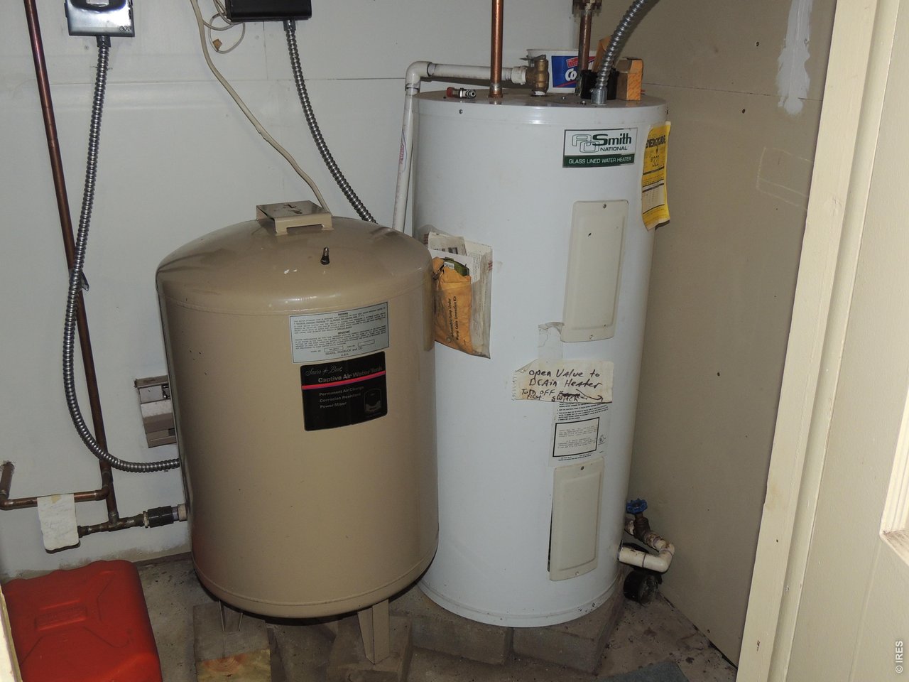 2300 Red Ashby Road Livermore, CO 80536 - Photo 25 of 32 Well storage tank and hot water heater