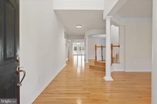 a view of hallway with wooden floor
