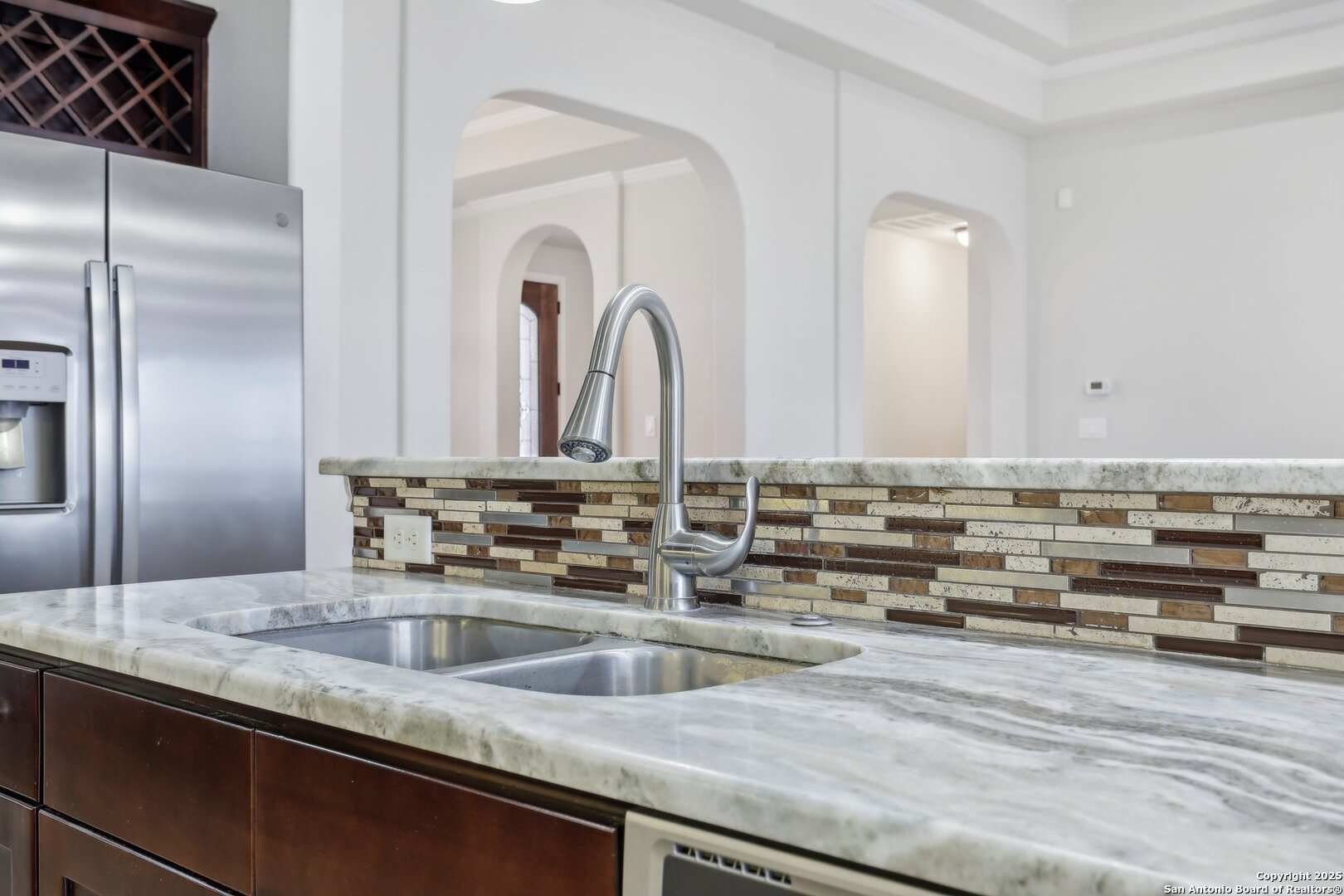 138 Gable Street Kyle, TX 78640 - Photo 12 of 51 a view of a kitchen counter top a sink and dishwasher