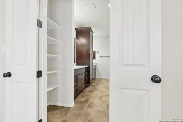 a view of a hallway with a white walls