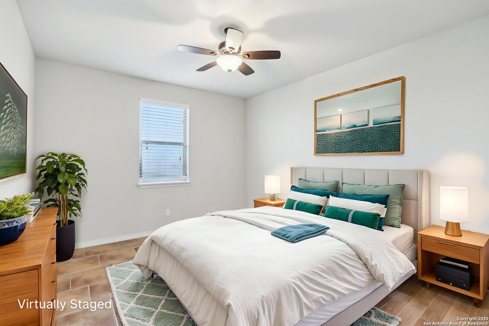 138 Gable Street Kyle, TX 78640 - Photo 25 of 51 a bedroom with a bed and a chandelier