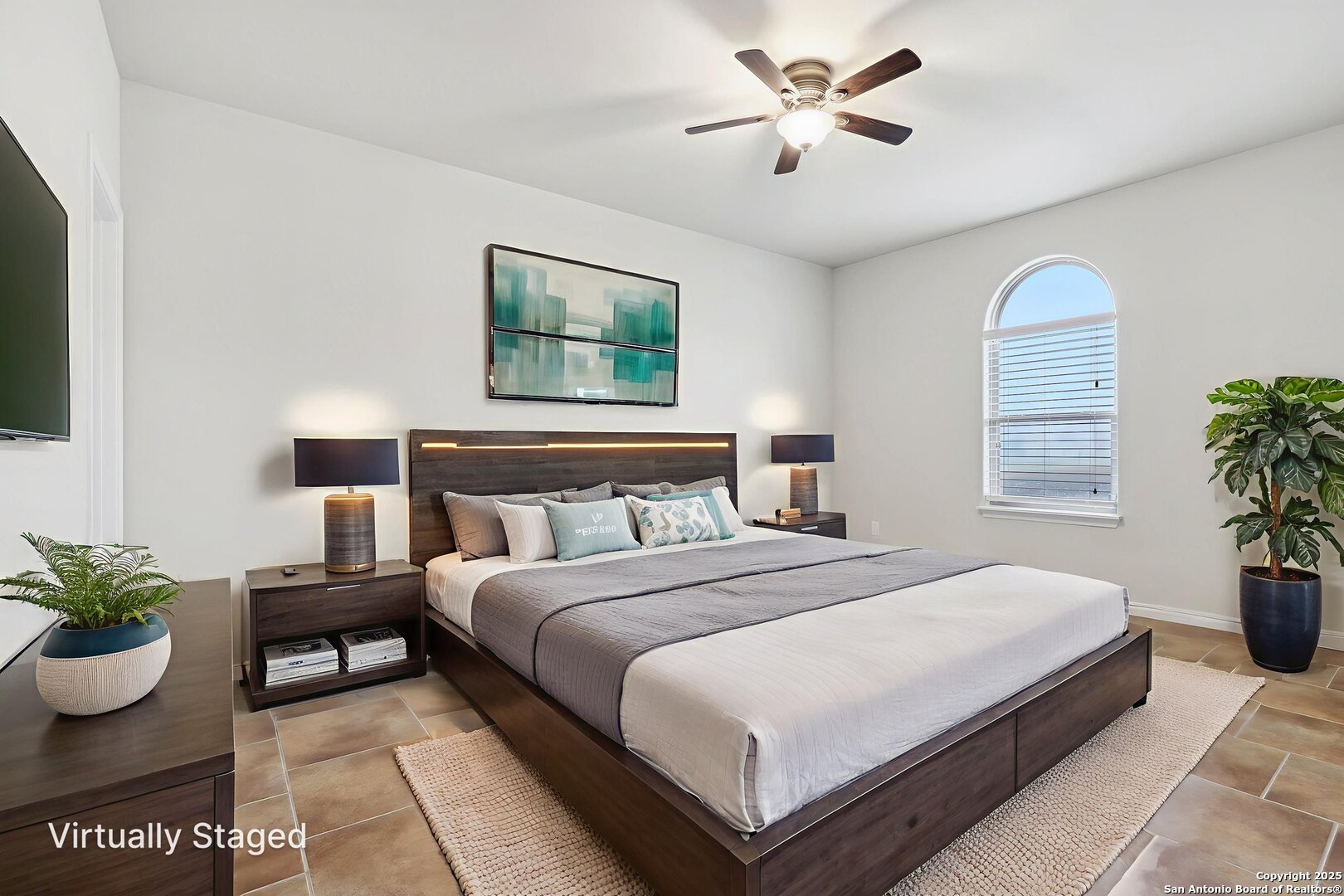 138 Gable Street Kyle, TX 78640 - Photo 27 of 51 a bedroom with bed and a potted plant