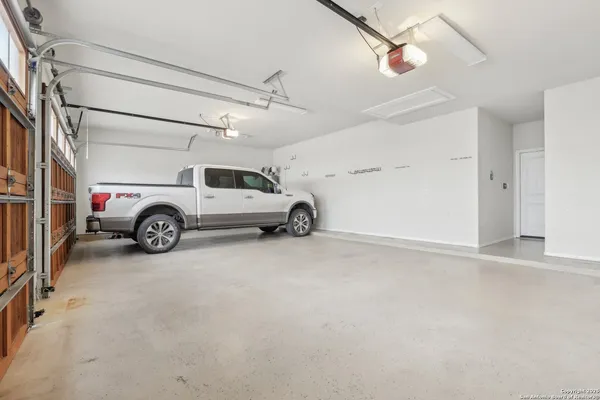 a view of parking garage with cars
