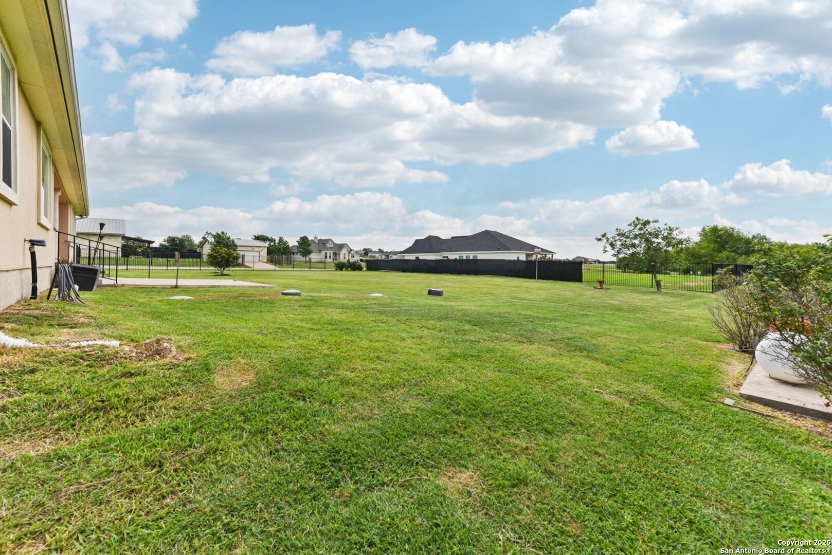 138 Gable Street Kyle, TX 78640 - Photo 35 of 51 a view of a grassy field with an trees