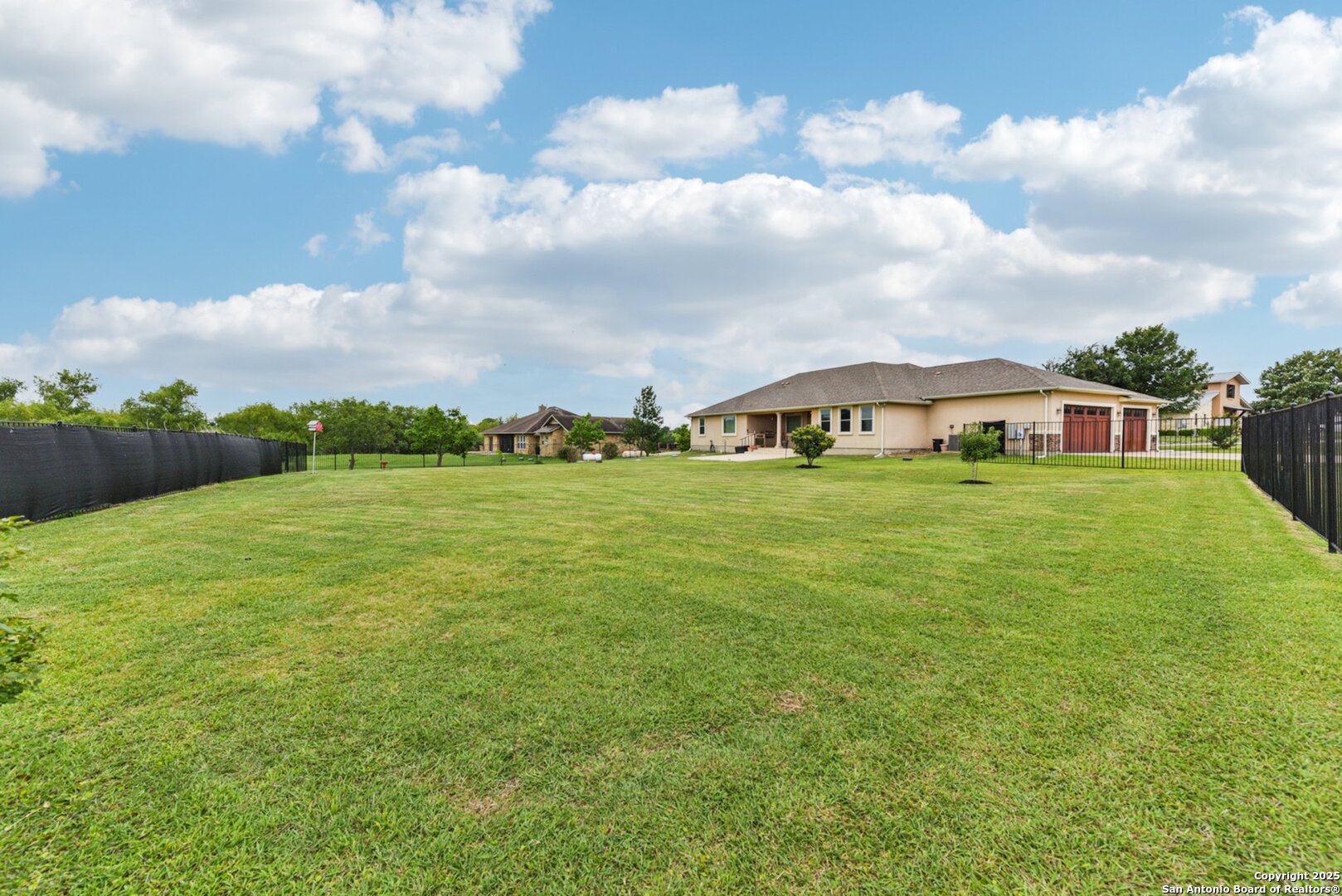 138 Gable Street Kyle, TX 78640 - Photo 40 of 51 a view of an house with backyard and garden