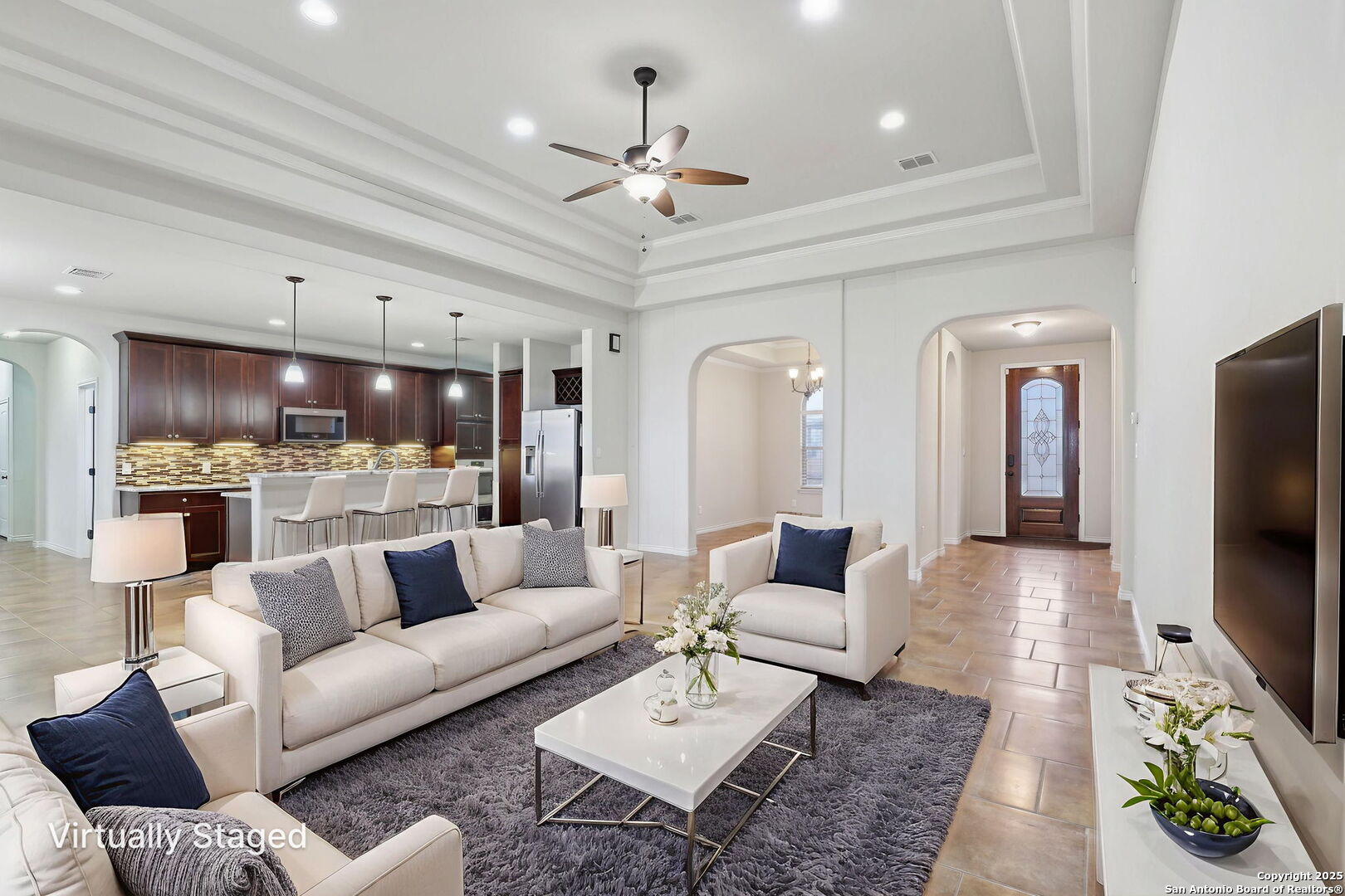 138 Gable Street Kyle, TX 78640 - Photo 4 of 51 a living room with furniture and a flat screen tv