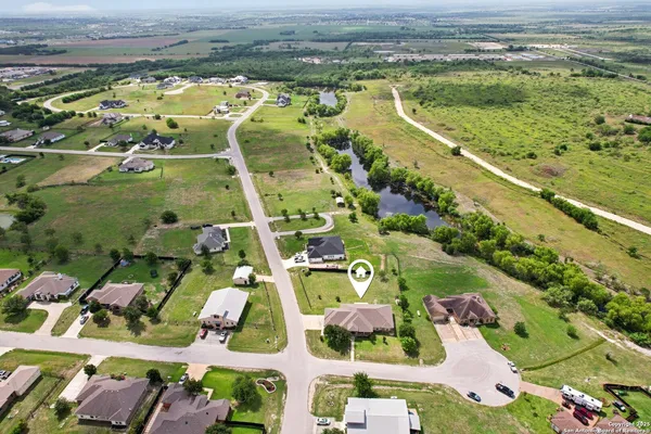 an aerial view of residential houses with outdoor space