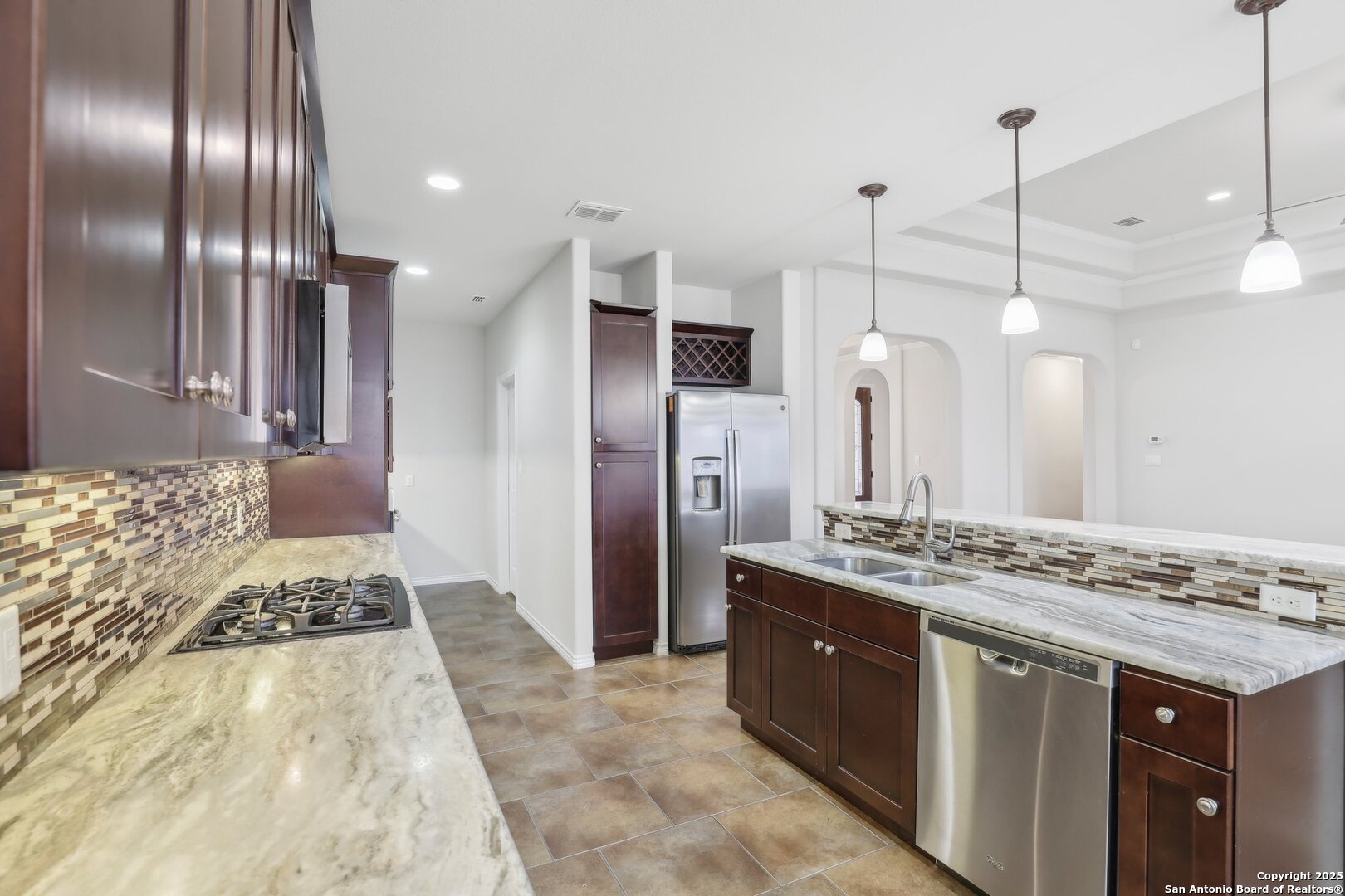 138 Gable Street Kyle, TX 78640 - Photo 9 of 51 a bathroom with a granite countertop sink a large mirror and shower