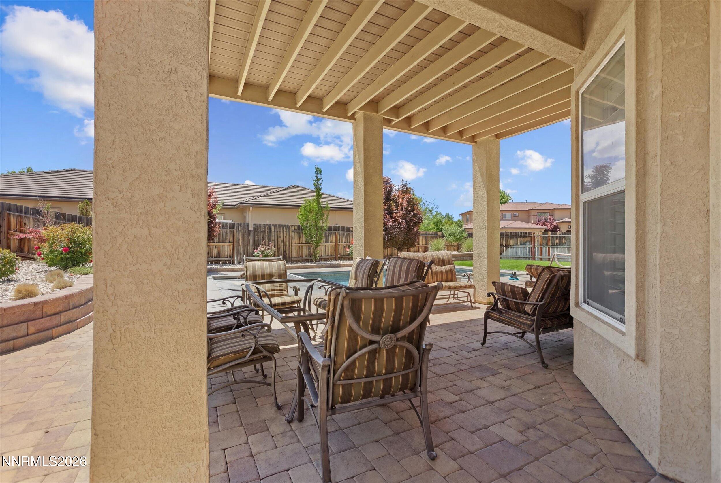 2920 Bull Rider Drive Reno, NV 89521 - Photo 38 of 51 a view of a dining room with furniture large windows and wooden floor