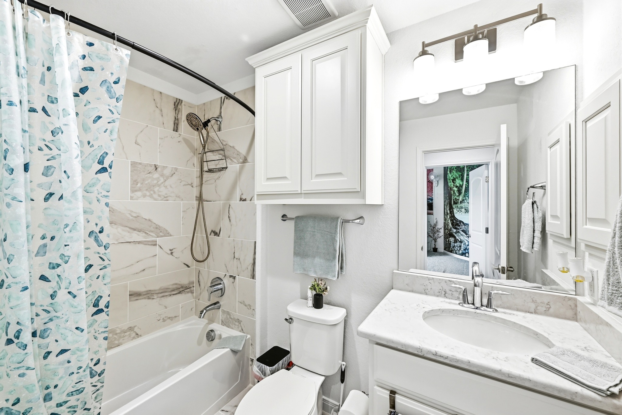 4601 Apollonia Way Leander, TX 78641 - Photo 29 of 40 a bathroom with a granite countertop sink a toilet and a bathtub