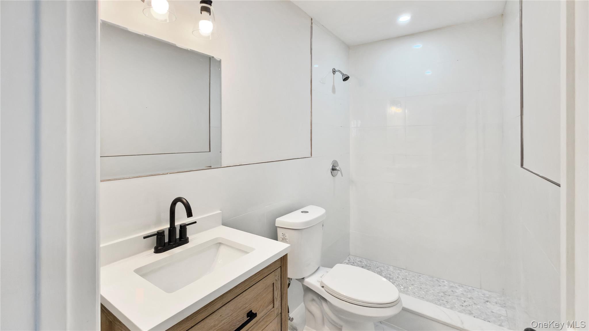 37 Deal Road Island Park, NY 11558 - Photo 29 of 50 Bathroom with vanity and a stall shower