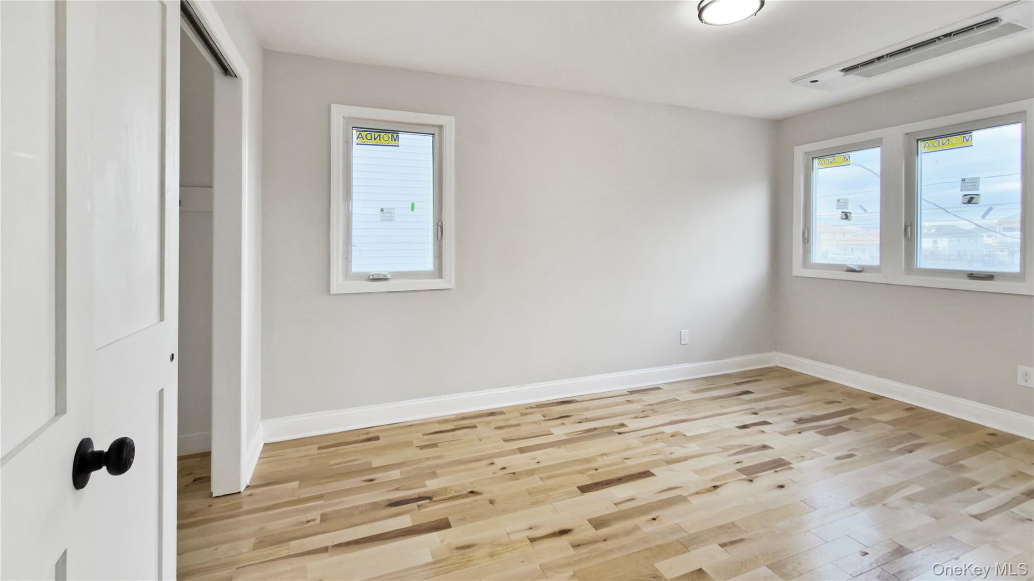 37 Deal Road Island Park, NY 11558 - Photo 34 of 50 Unfurnished bedroom featuring light wood-style floors and a closet