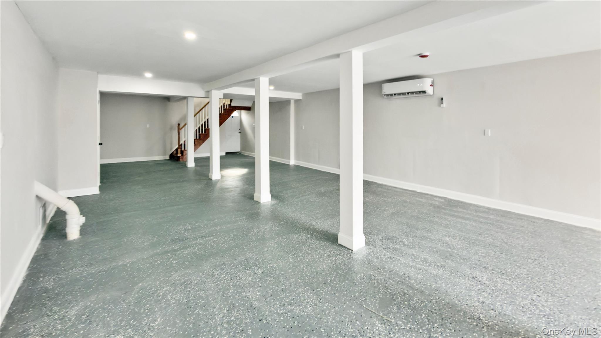 37 Deal Road Island Park, NY 11558 - Photo 37 of 50 Finished basement featuring stairs and a wall unit AC