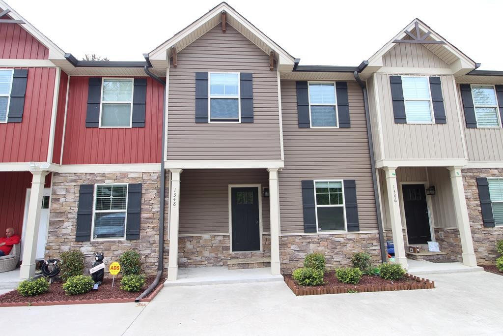 1348 Weeks Drive Northeast Cleveland, TN 37312 - Photo 1 of 25 a front view of a house with a yard and potted plants