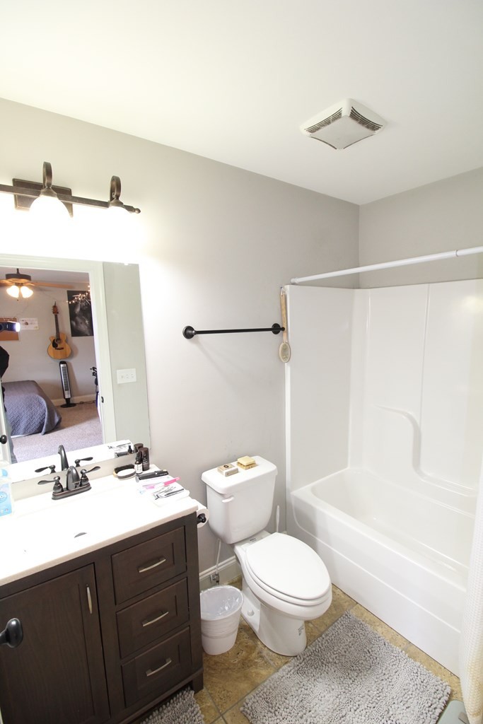 1348 Weeks Drive Northeast Cleveland, TN 37312 - Photo 16 of 25 a bathroom with a sink a toilet and shower
