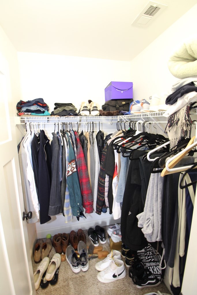 1348 Weeks Drive Northeast Cleveland, TN 37312 - Photo 17 of 25 a view of walk in closet with clothes and shoes