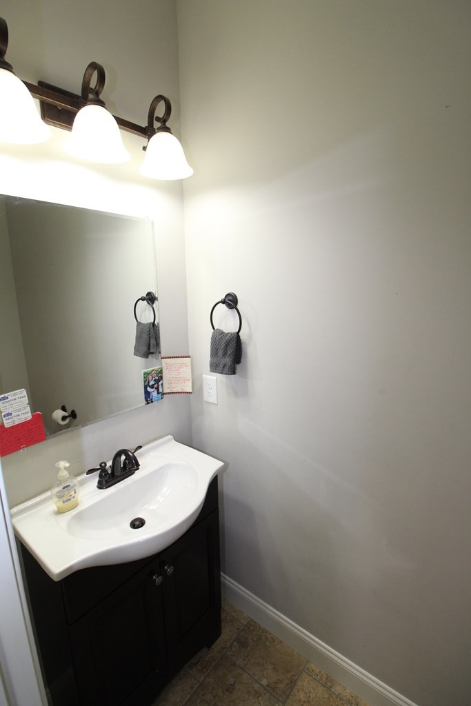 1348 Weeks Drive Northeast Cleveland, TN 37312 - Photo 19 of 25 a bathroom with a sink and mirror