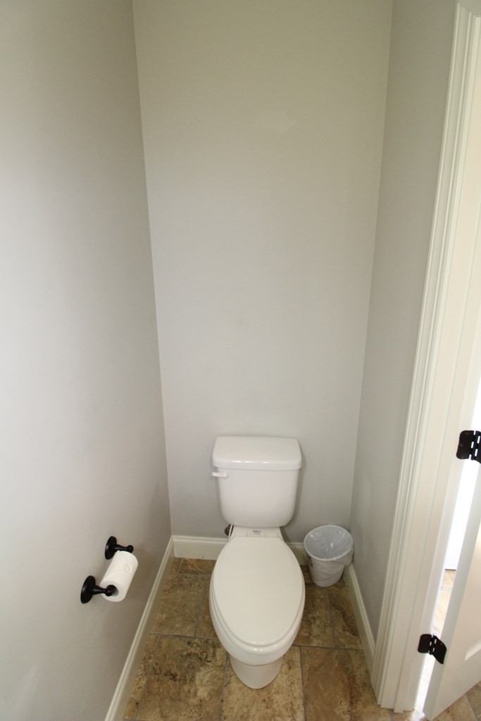 1348 Weeks Drive Northeast Cleveland, TN 37312 - Photo 20 of 25 a white toilet sitting next to a white cabinet