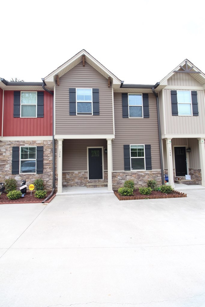 1348 Weeks Drive Northeast Cleveland, TN 37312 - Photo 2 of 25 a front view of a house with a yard