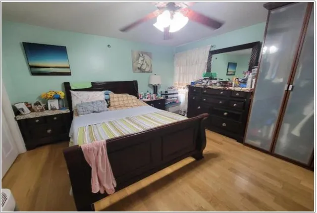 a bedroom with a bed and a dresser