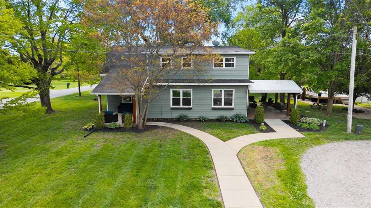 5120 Wheelock Road Troy, OH 45373 - Photo 66 of 67 This charming home offers a welcoming facade with a covered porch and mature trees.