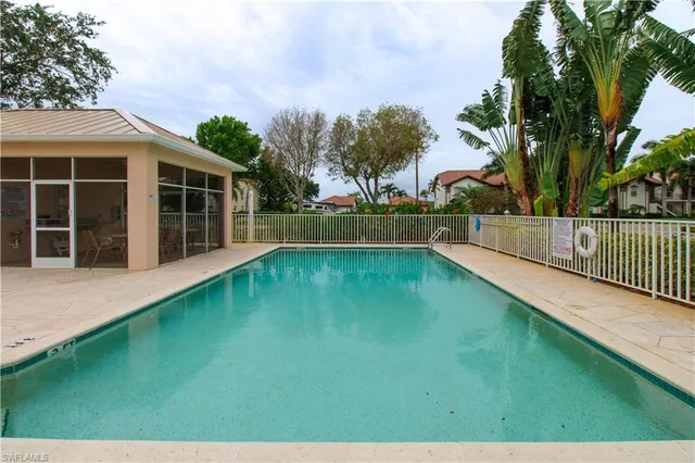 a view of a backyard with a garden and trees