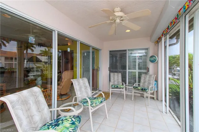 a view of a porch with furniture and garden