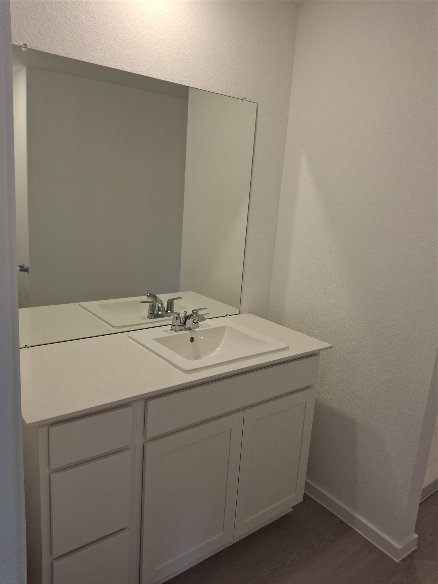 16126 Rustic Prairie Drive Grand Prairie, TX 75050 - Photo 15 of 17 a bathroom with a sink and a mirror