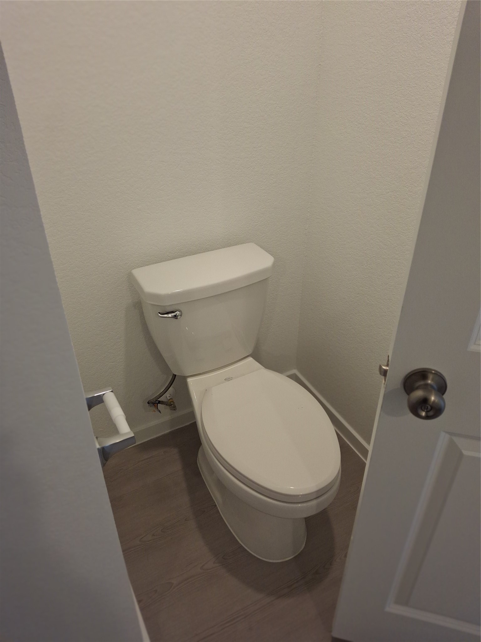 16126 Rustic Prairie Drive Grand Prairie, TX 75050 - Photo 16 of 17 a white toilet sitting next to a shower