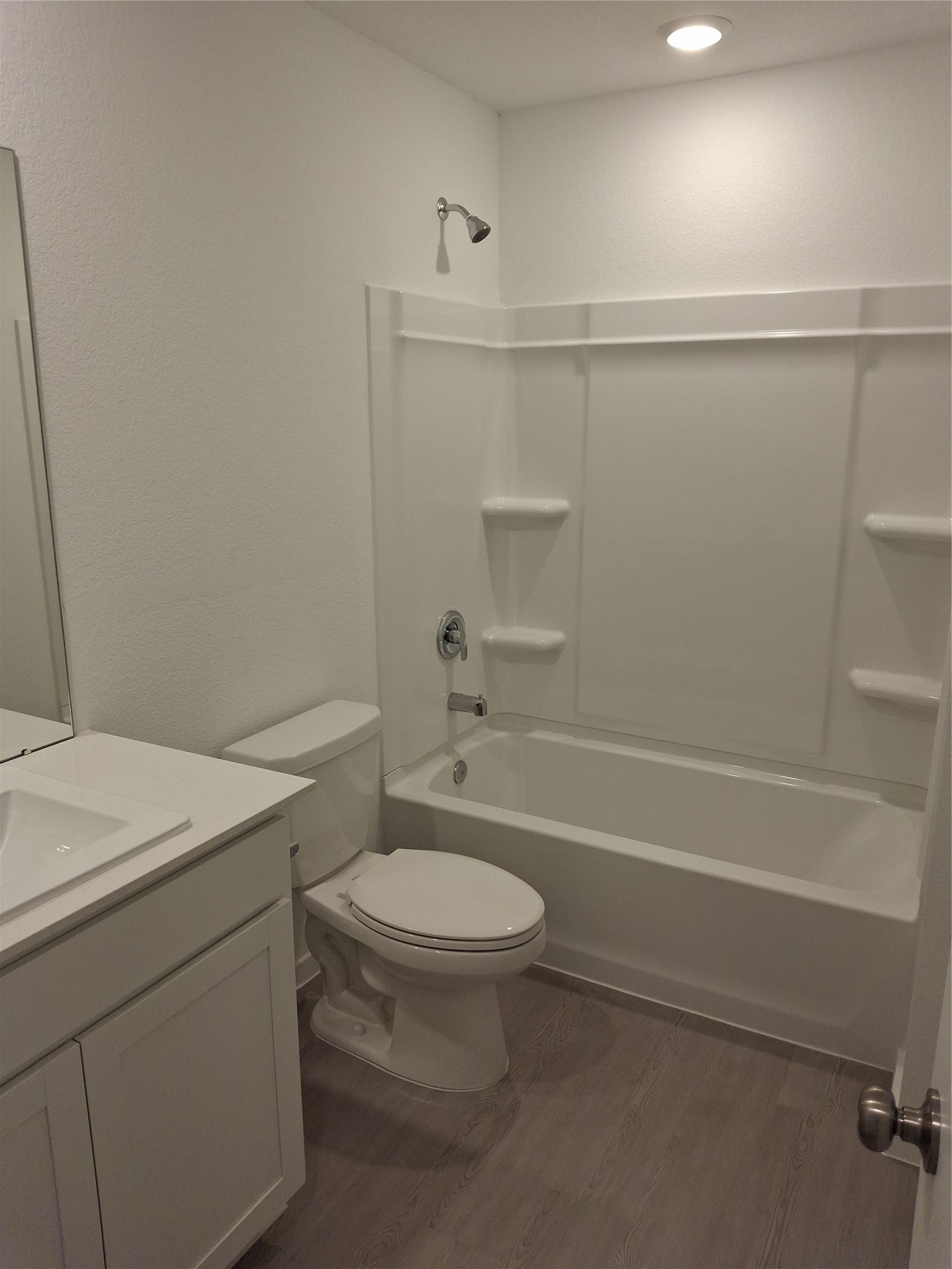 16126 Rustic Prairie Drive Grand Prairie, TX 75050 - Photo 7 of 17 a bathroom with a sink a toilet and shower