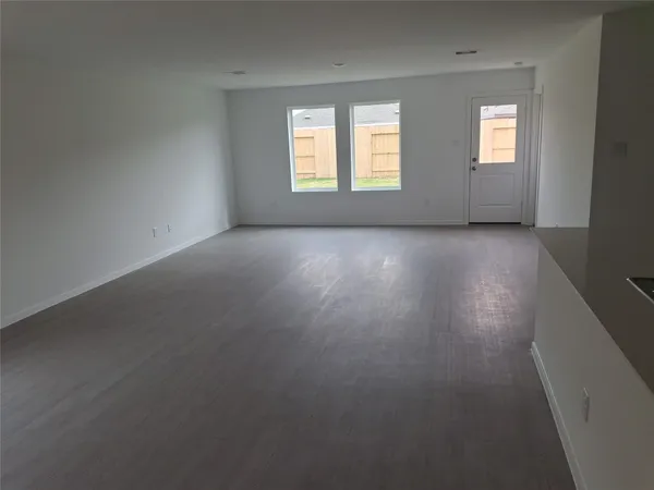 a kitchen with a refrigerator and a sink