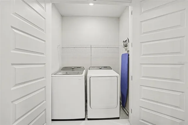 a utility room with dryer and washer