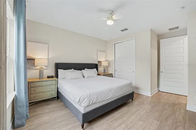 a bedroom with a bed and a closet