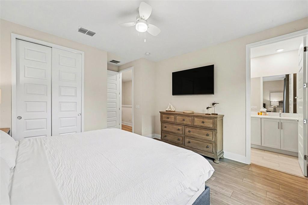 7841 Spectrum Drive Reunion, FL 34747 - Photo 15 of 30 a bedroom with a bed and a flat screen tv