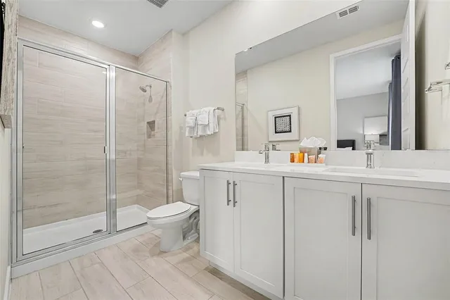 a bathroom with a sink toilet and shower
